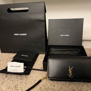 CASSANDRE SAINT LAURENT PHONE HOLDER WITH STRAP IN SMOOTH LEATHER